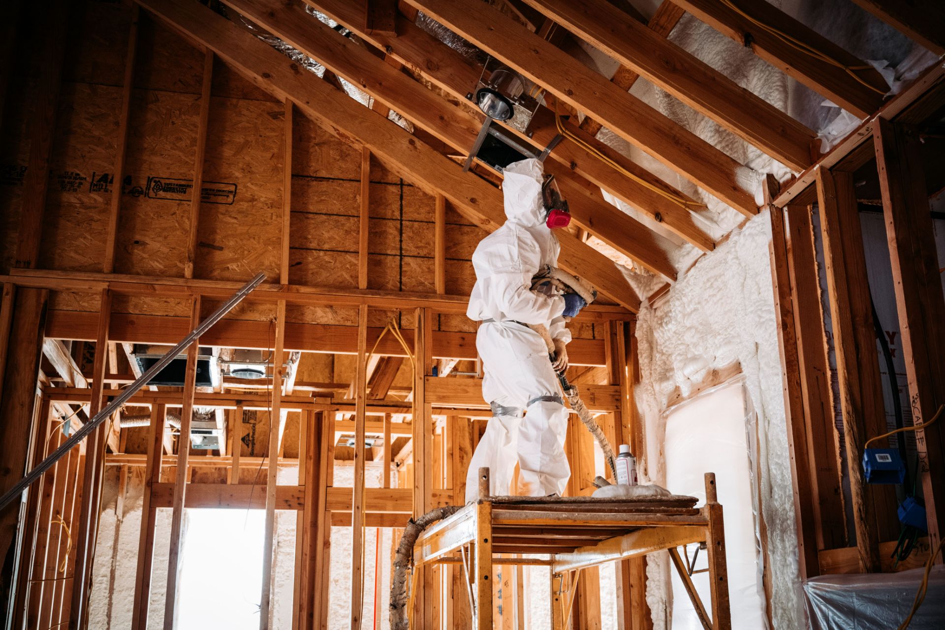 Spray foam insulation being applied to attic joists in Charlotte NC home