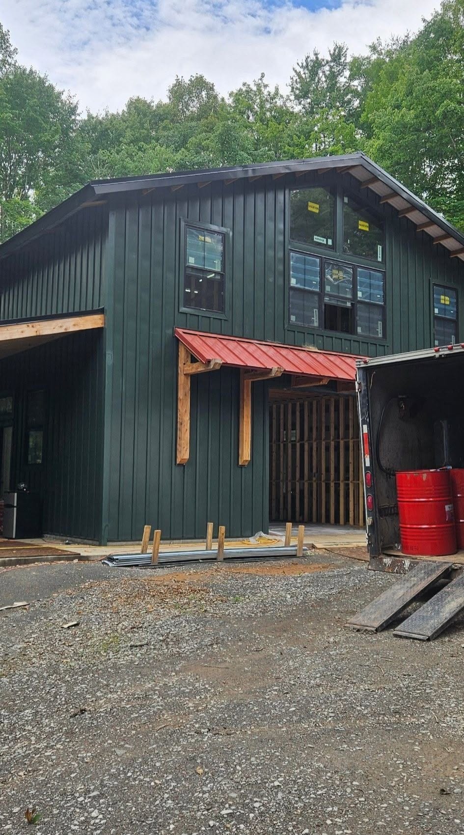 Board-and-batten barndominium-style building on a spray foam insulation job