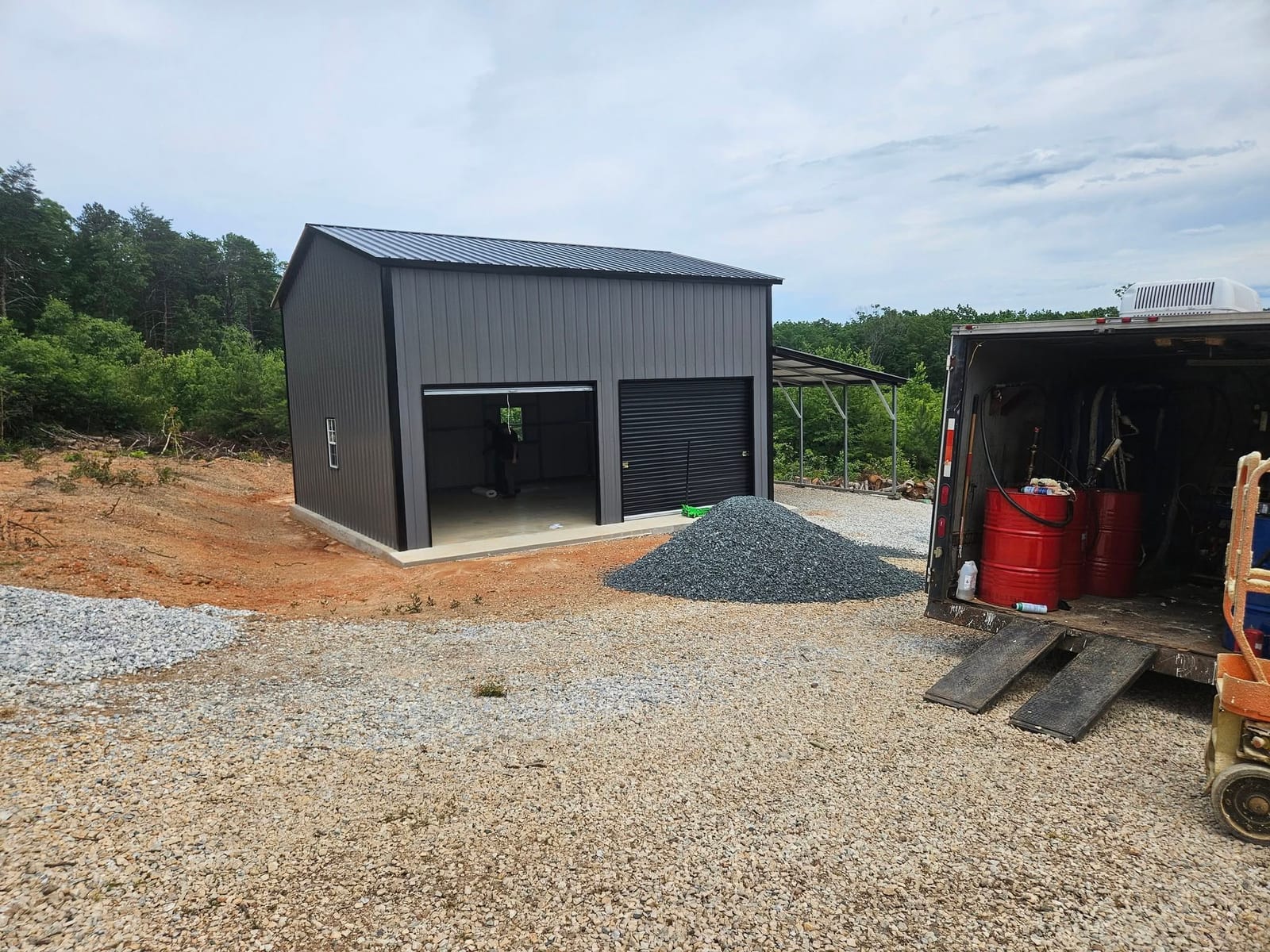 Dark gray metal garage on a spray foam insulation job