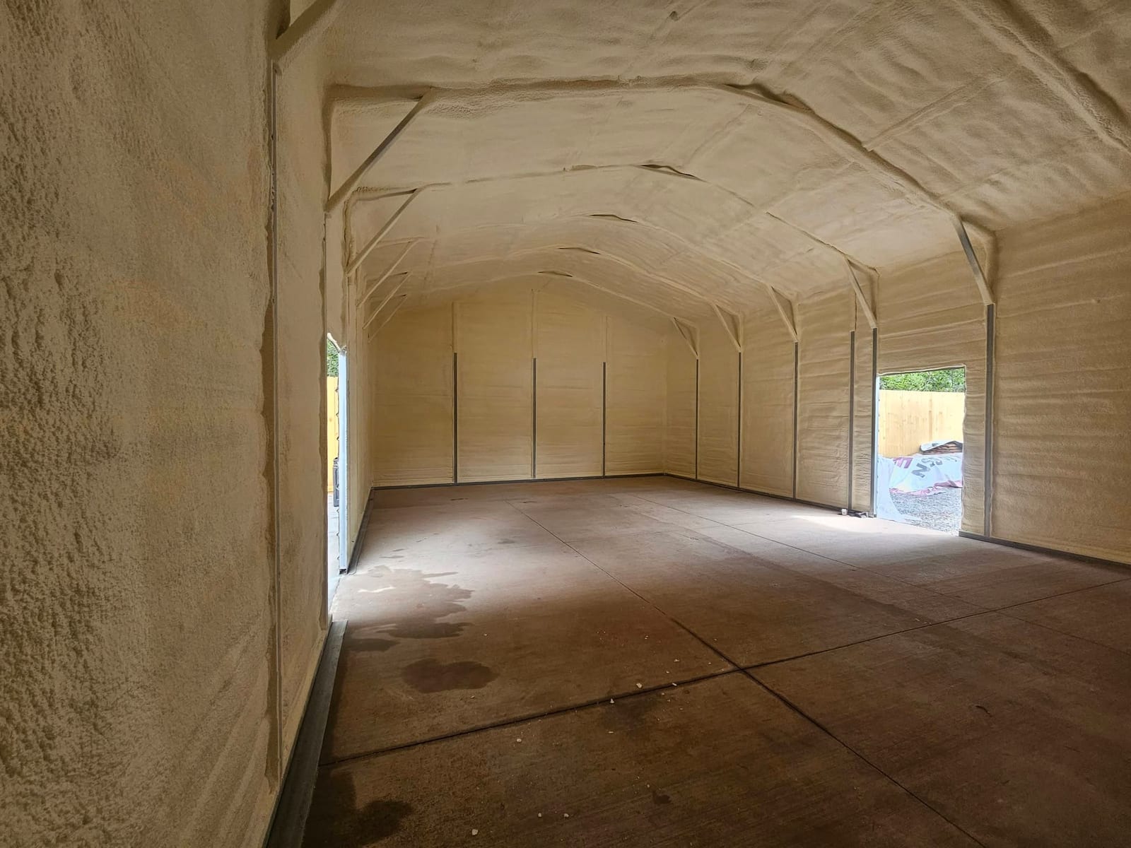 Shop interior with spray foam insulation on walls and ceiling